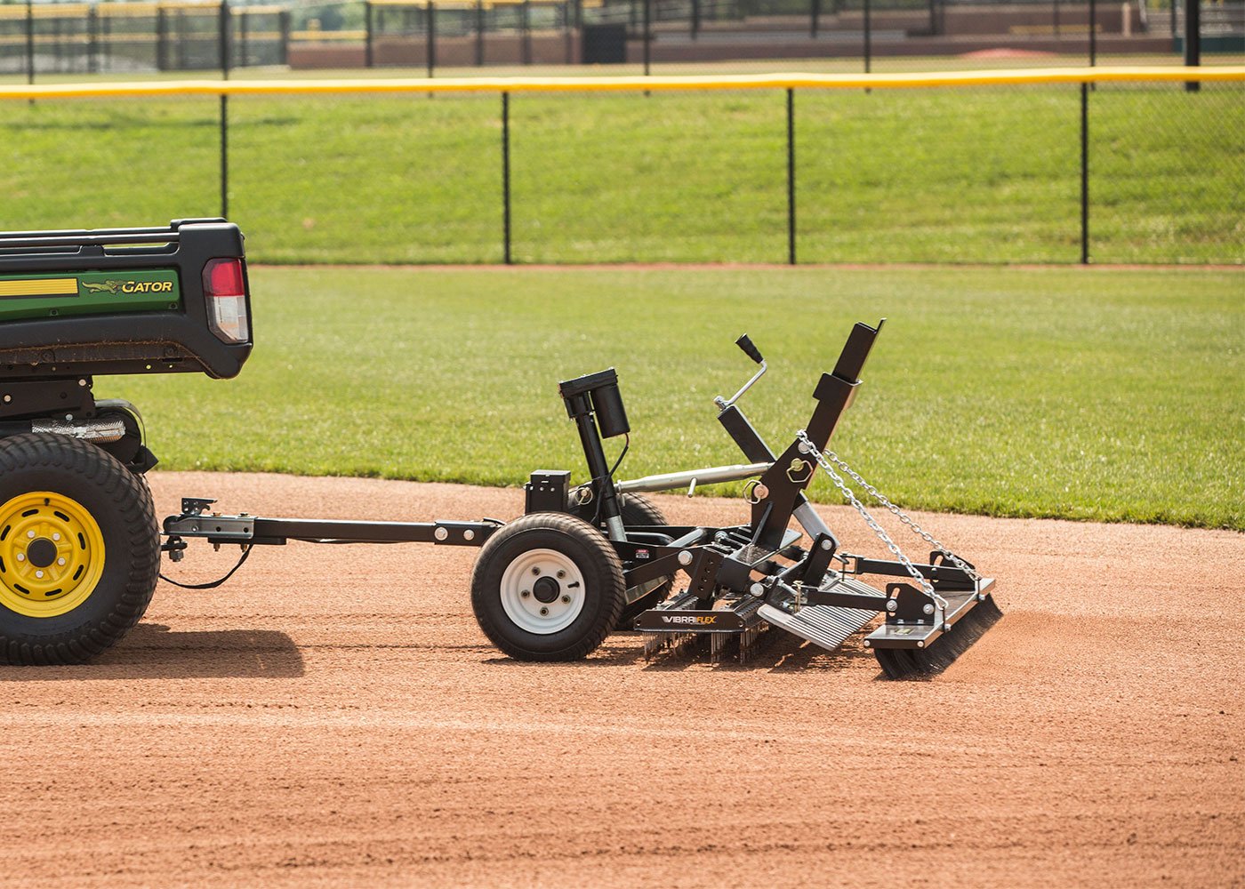 Fine finish broom attachment finishing infield with Force pull behind rascal mvp groomer 