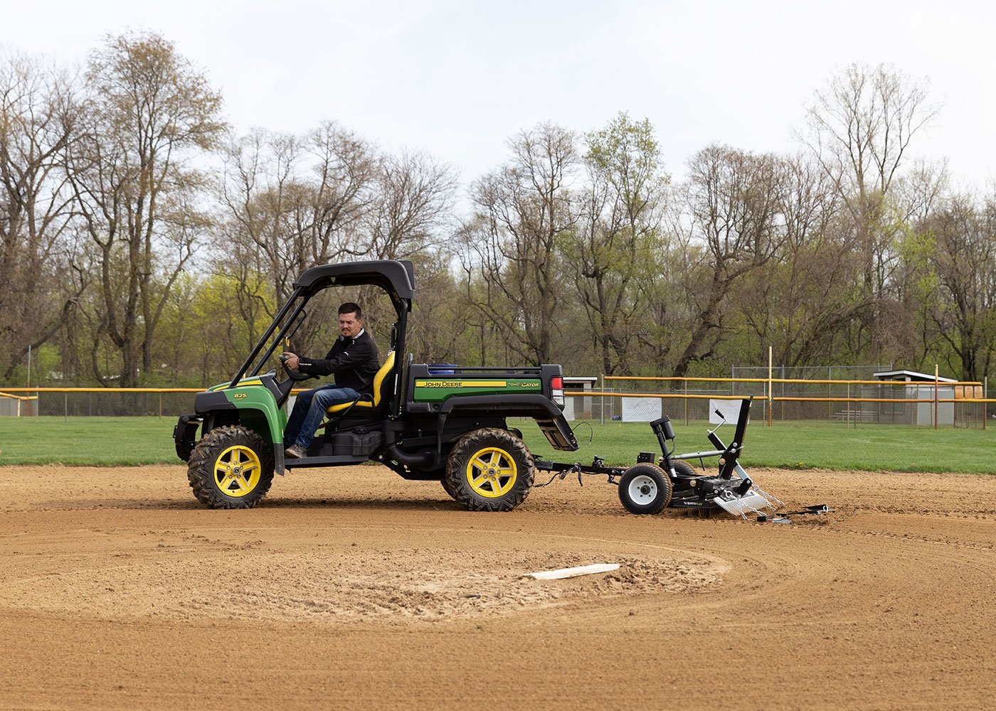 Pull behind groomer on gator for parks departments and other baseball and softball grooming needs on a budget 